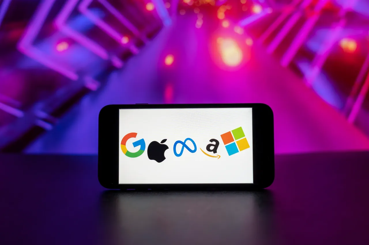 In this photo illustration, the big tech companies Google, Apple, Meta, Amazon, Microsoft logos seen displayed on a mobile phone screen.