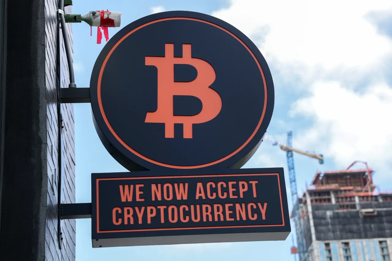A Bitcoin sign is displayed on the wall of developers Ciprés and Rilea Group in Miami, Florida. 