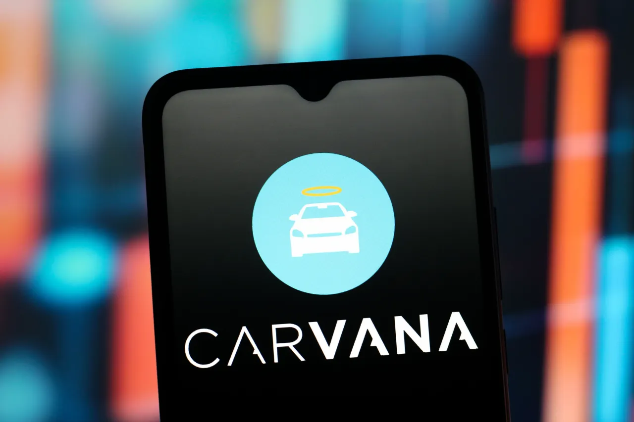 In this photo illustration, the Carvana logo is seen displayed on a smartphone screen.