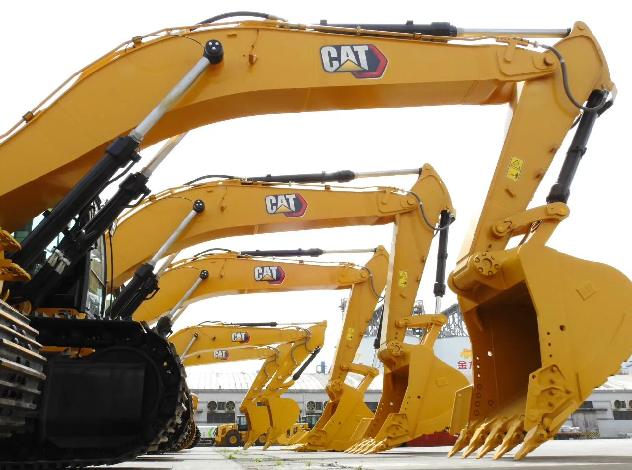  Construction machines from Caterpillar Inc. stand ready for shipment at Lianyungang port on May 13, 2020. 