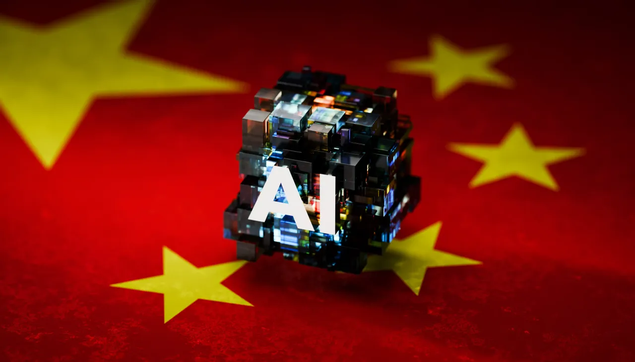 Abstract AI Symbol Hovering Above Chinese Flag – Representing AI Innovation and Technology in China - stock photo courtesy of J Studios via Getty Images