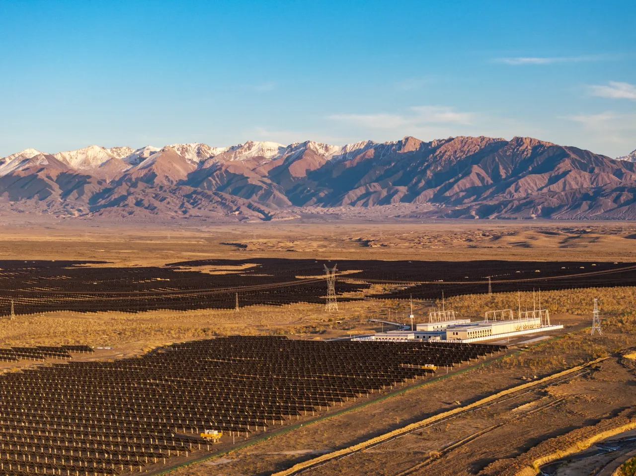 Solar photovoltaic panels solar farm are angled up towards the sky from a desert floor,Xinjiang Uygur Autonomous Region,china.