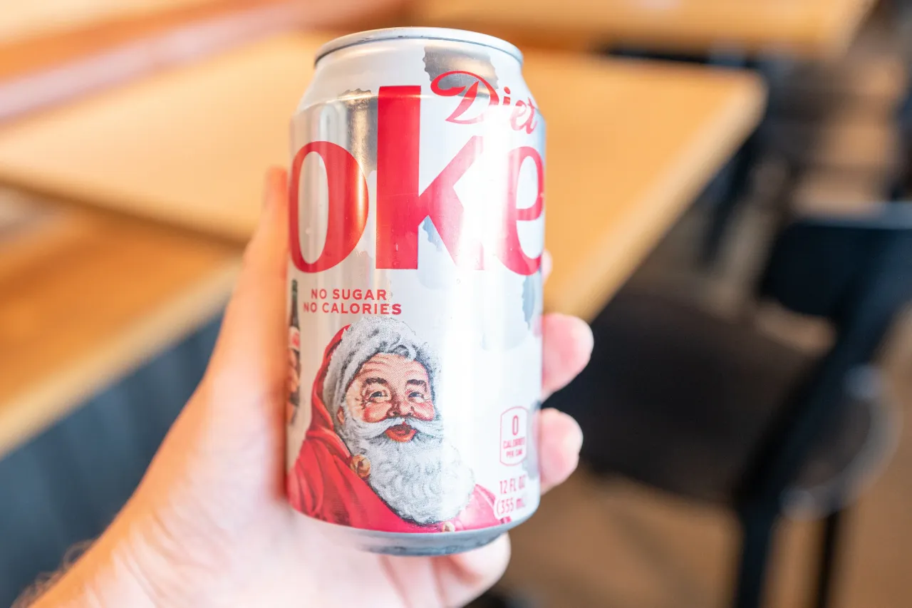 Person's hand holding a Coca Cola Diet Coke can with a stylized image of Santa Claus, San Ramon, California, December, 2025. 