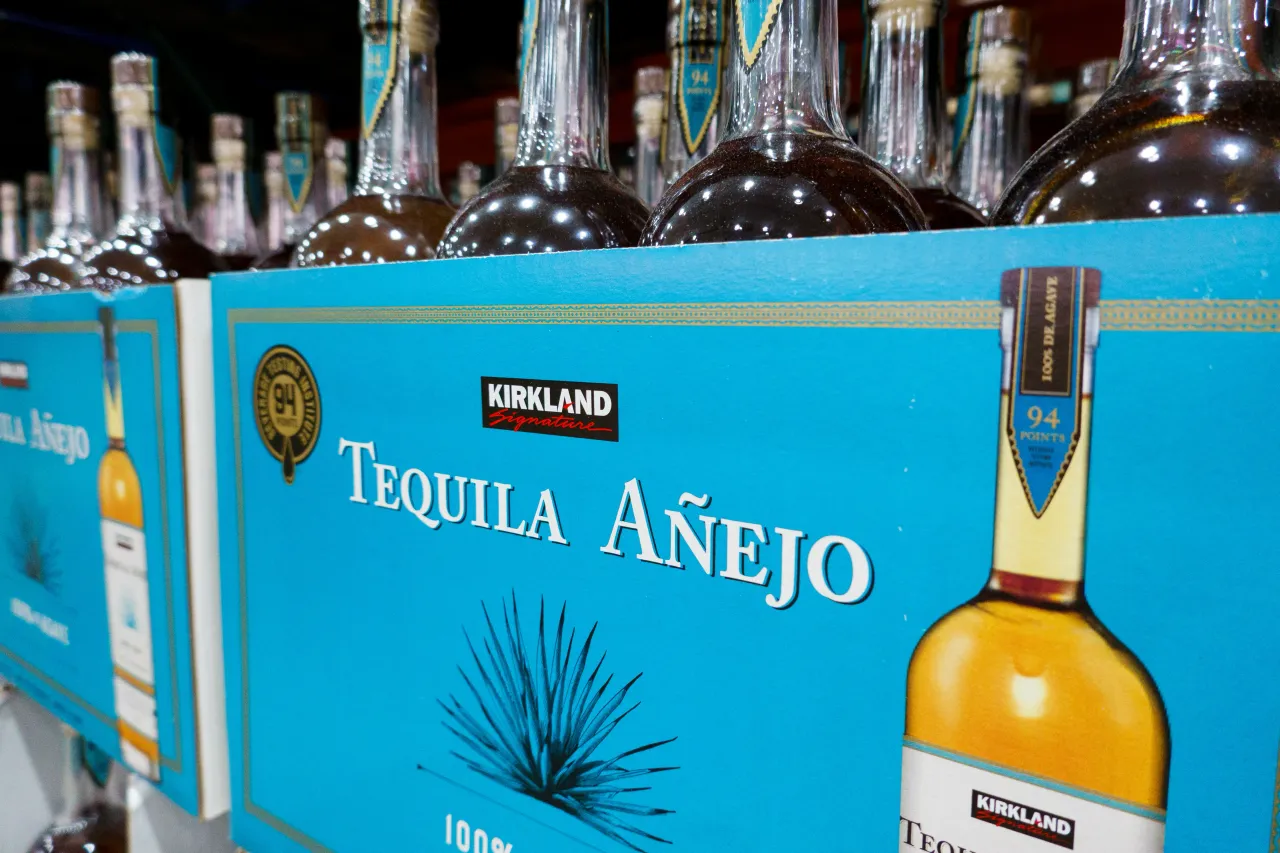 Bottles of Kirkland Signature Tequila Anejo are displayed for sale at a Costco Wholesale store on November 18, 2025 in San Diego, California.