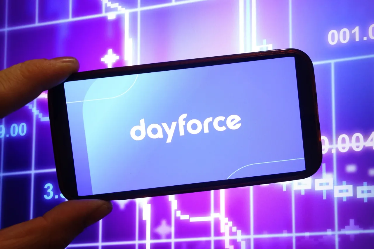 In this photo illustration, the Dayforce Inc company logo is seen displayed on a smartphone screen.
