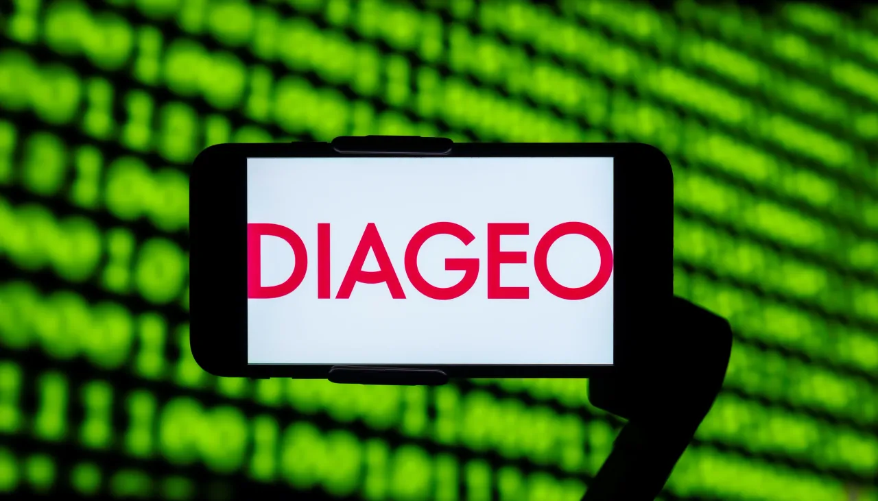  In this photo illustration, the logo of Diageo plc seen displayed on a mobile phone screen.