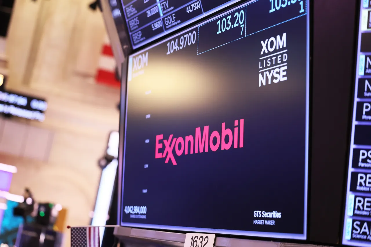 The ExxonMobil company logo is displayed as traders work on the floor of the New York Stock Exchange during morning trading on May 30, 2023.