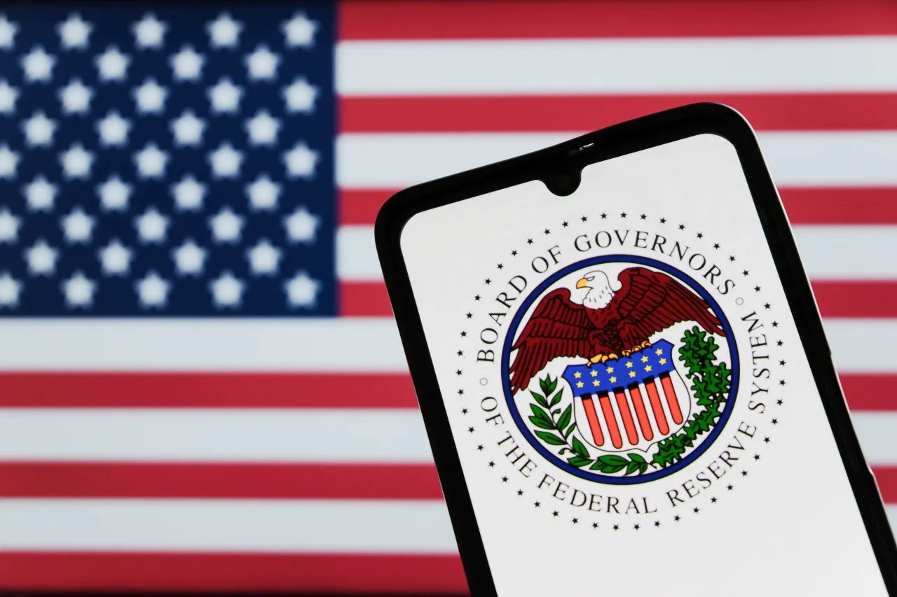 In this photo illustration, The Federal Reserve System logo displayed on a smartphone. 