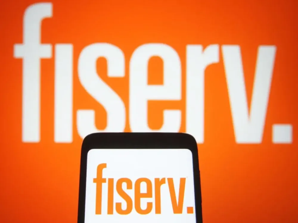 In this Photo illustration a Fiserv logo is seen on a smartphone and a pc screen. (Photo Illustration by Pavlo Gonchar/SOPA Images/LightRocket via Getty Images)
