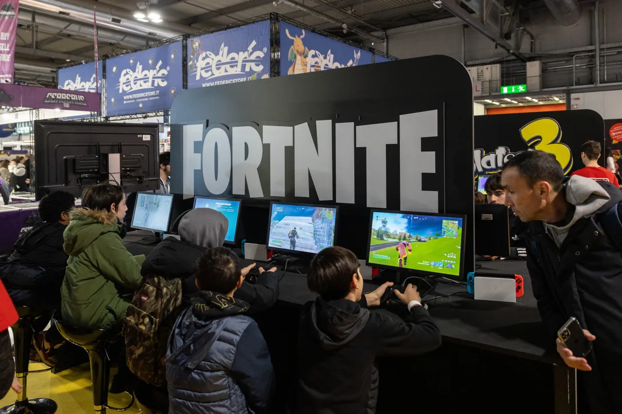 Fairgoers play video games at the Japanese publisher Nintendo Switch's stand during Milan Games Week & Cartoomics 2024 at Fiera Milano Rho on November 22, 2024 in Milan, Italy. 