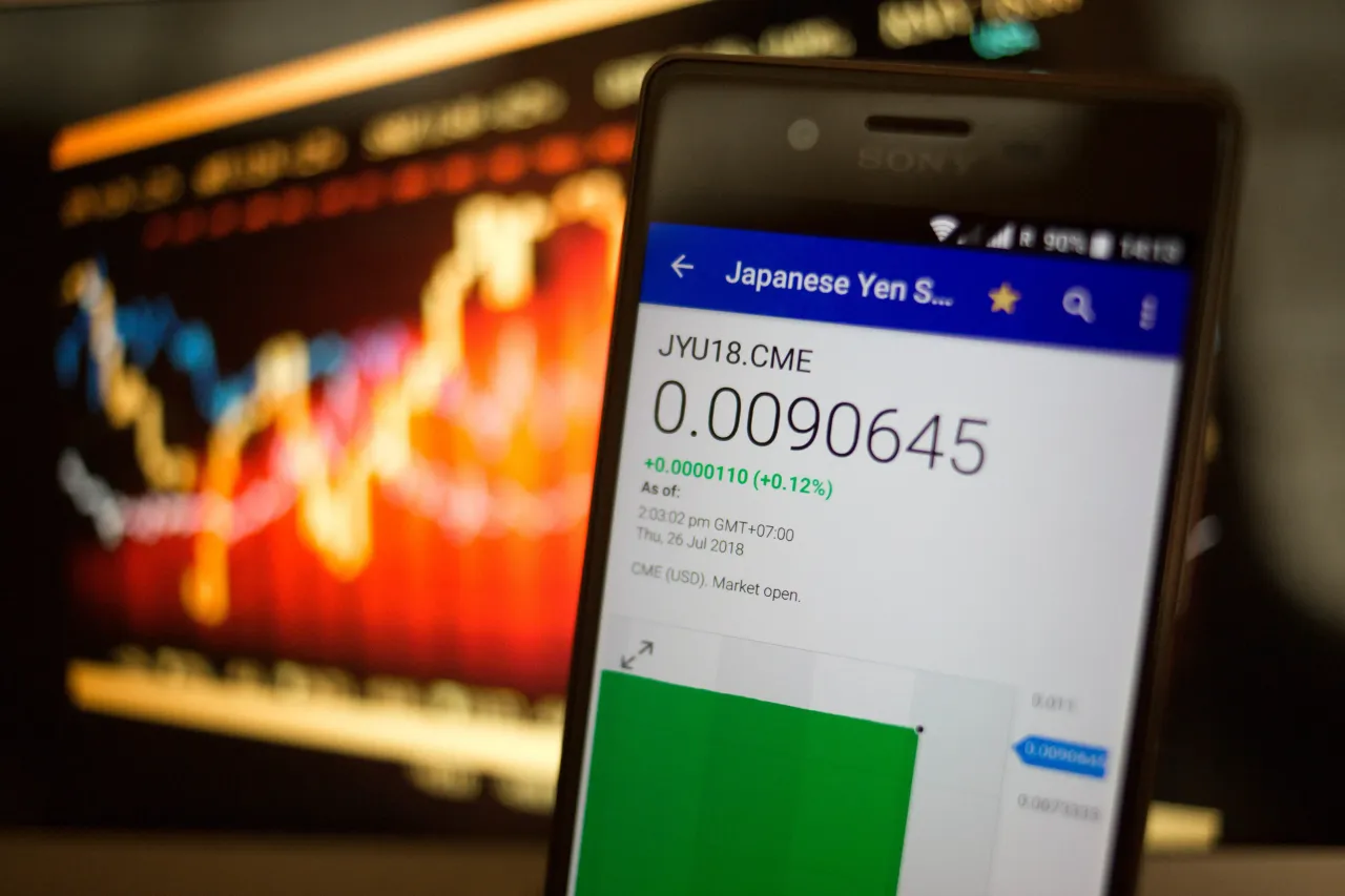 A smartphone displays the Japanese Yen Sep 18 market value. (Photo Illustration by Guillaume Payen/SOPA Images/LightRocket via Getty Images)