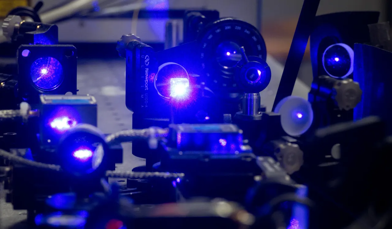 Blue laser light shines in a part of an optical clock in a laboratory at the Physikalisch-Technische Bundesanstalt (PTB) in Braunschweig, Germany. (Photo by Julian Stratenschulte/picture alliance via Getty Images)