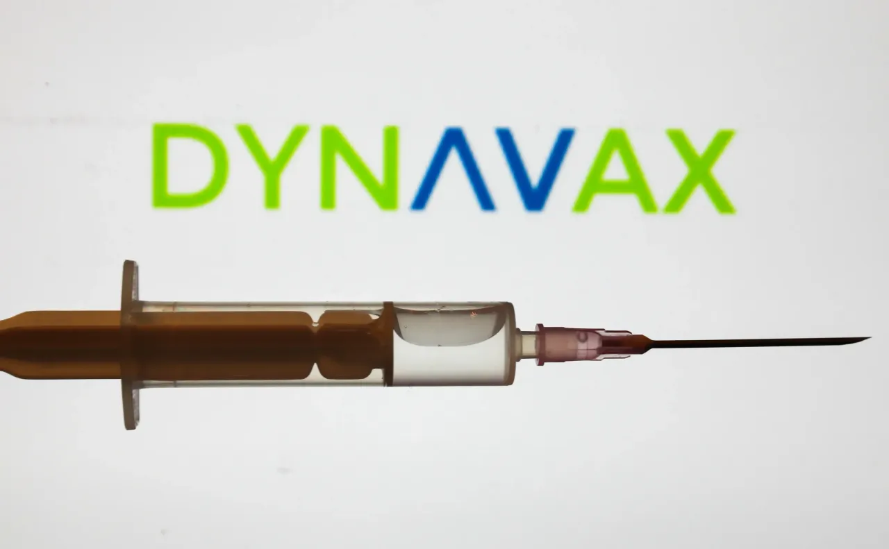 Medical syringe is seen with Dynavax company logo displayed on a screen in the background in this illustration photo taken in Poland on June 16, 2020. (Photo Illustration by Jakub Porzycki/NurPhoto via Getty Images)