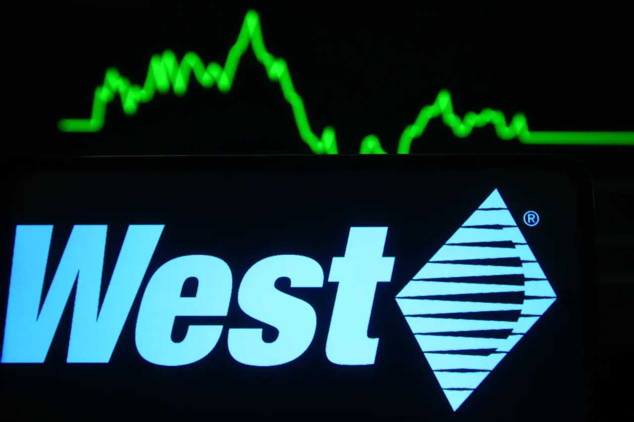 In this photo illustration a West Pharmaceutical Services logo is seen on a mobile phone screen in front of a graph. (Photo Illustration by Pavlo Gonchar/SOPA Images/LightRocket via Getty Images)
