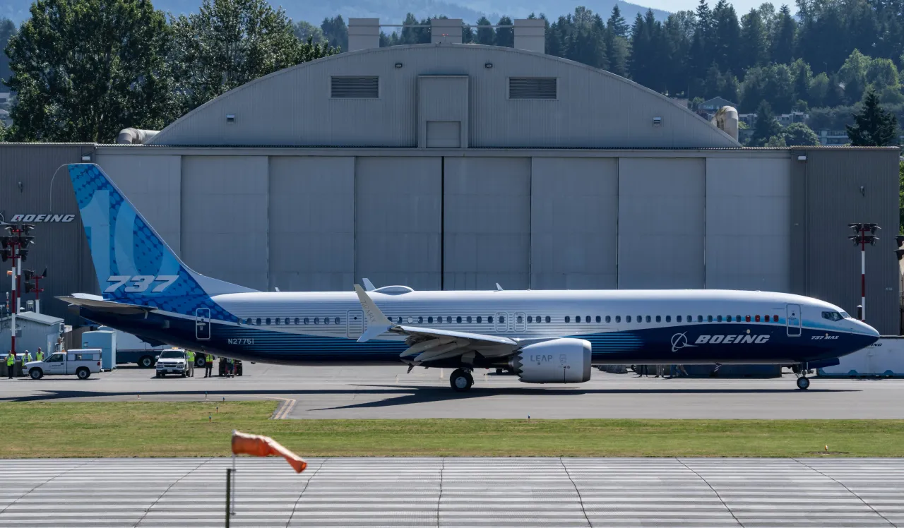 A Boeing 737 MAX 10 airliner taxis past a hanger on the flight line before its first flight at Renton Municipal Airport on June 18, 2021 in Renton, Washington.