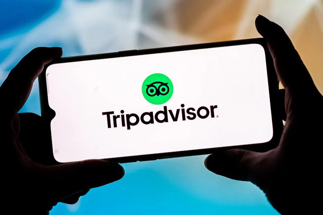 In this photo illustration a Tripadvisor logo seen displayed on a smartphone.