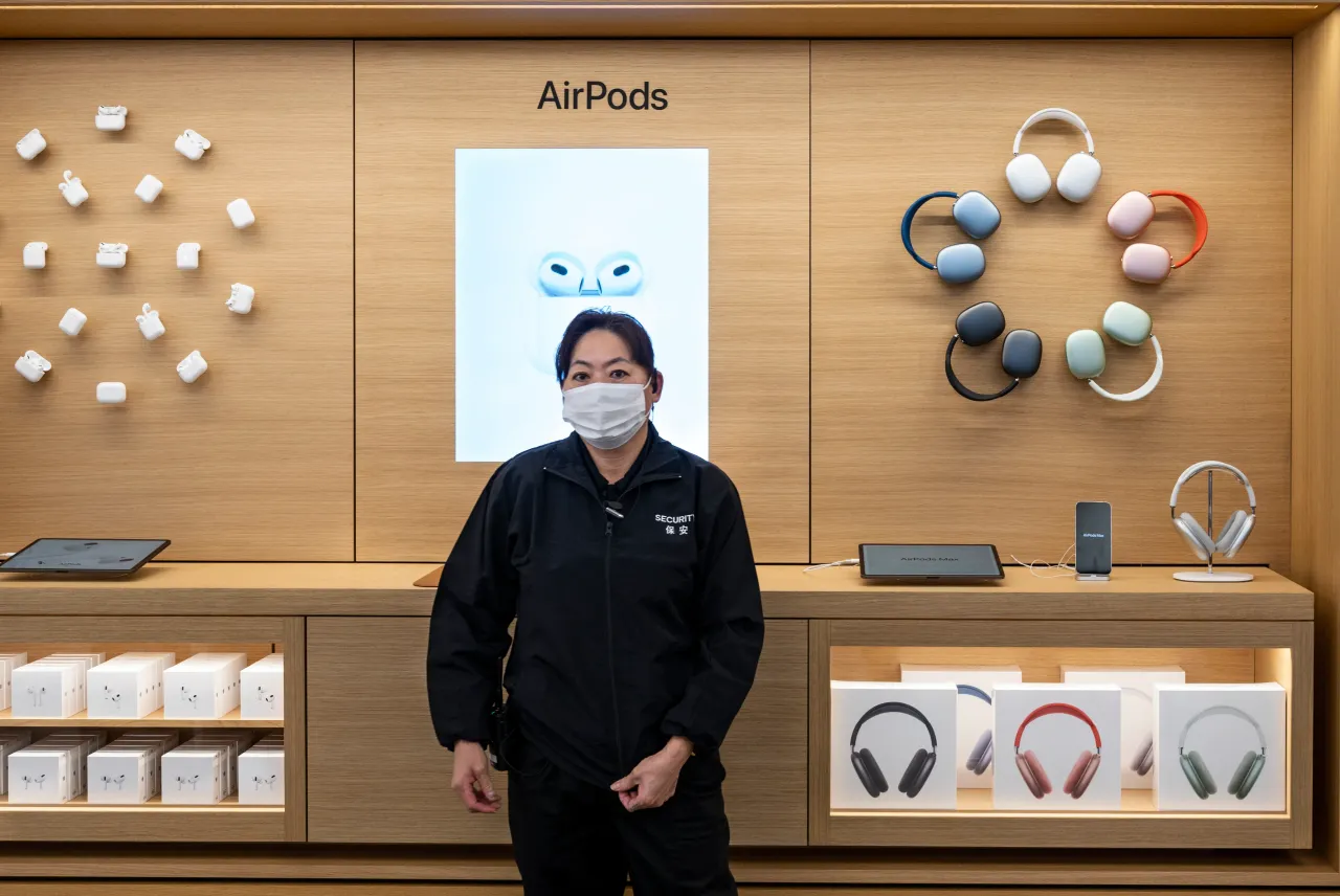 A security guard stands in an Apple store in Hong Kong. (Photo by Budrul Chukrut/SOPA Images/LightRocket via Getty Images)
