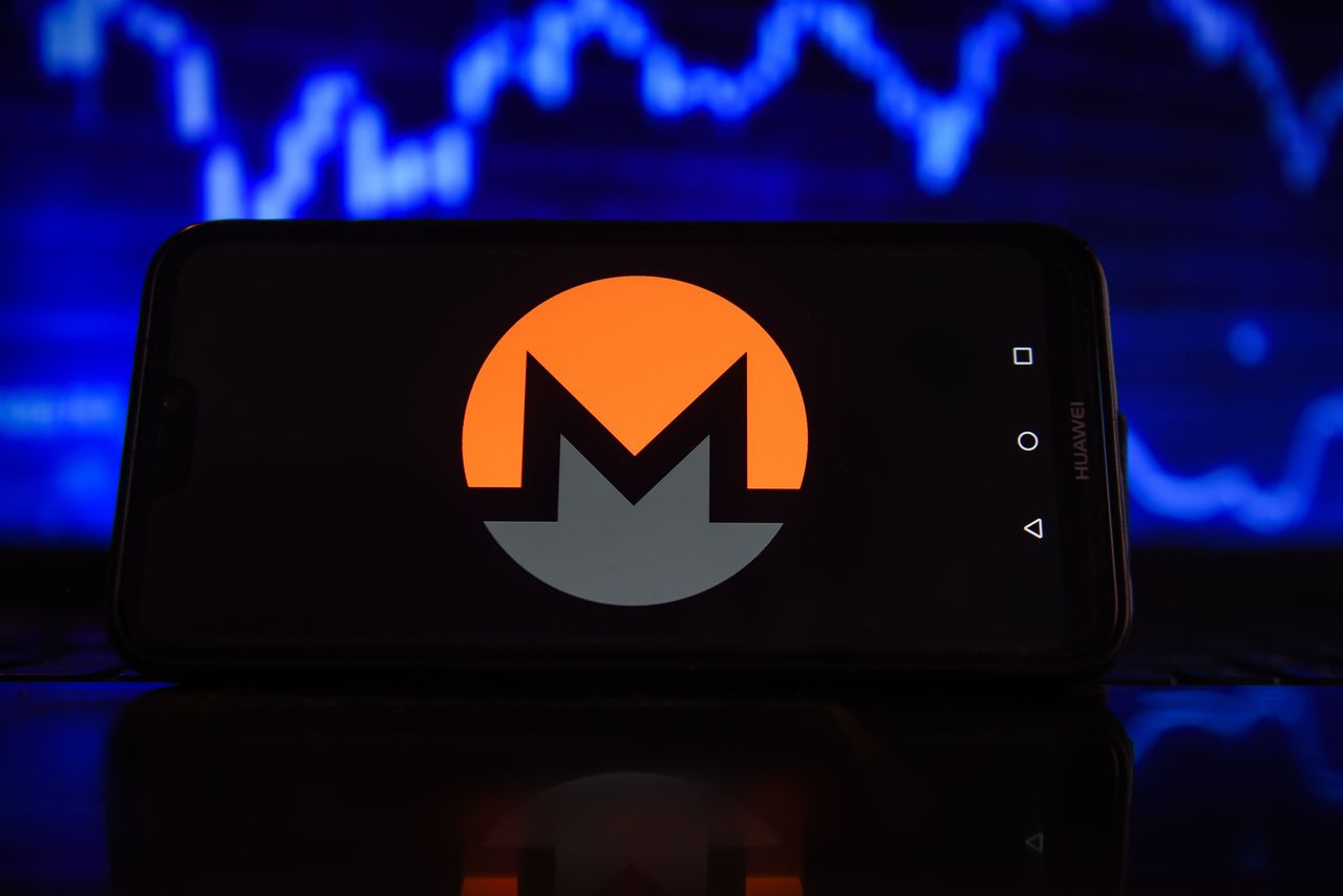 In this photo illustration a Monero logo seen displayed on a smartphone with stock market percentages in the background. (Photo Illustration by Omar Marques/SOPA Images/LightRocket via Getty Images)