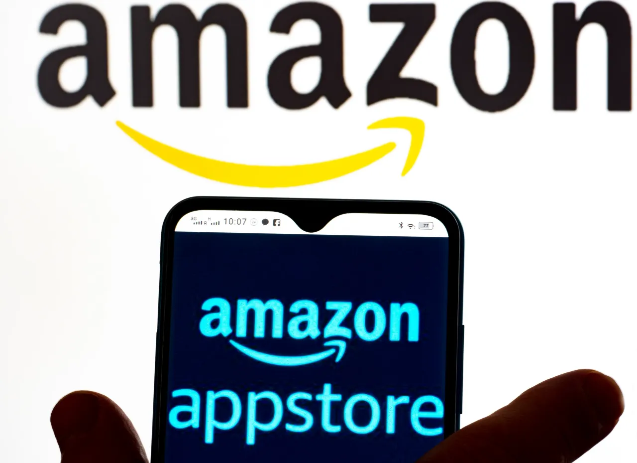 In this photo illustration, the Amazon AppStore logo is seen displayed on a smartphone screen and Amazon logo in the background. (Photo Illustration by Igor Golovniov/SOPA Images/LightRocket via Getty Images)