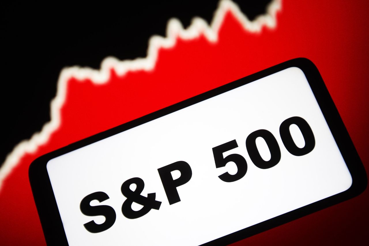 In this photo illustration, a S&P 500 stock market index words are seen on a smartphone screen and a graphic in the background. (Photo Illustration by Pavlo Gonchar/SOPA Images/LightRocket via Getty Images)