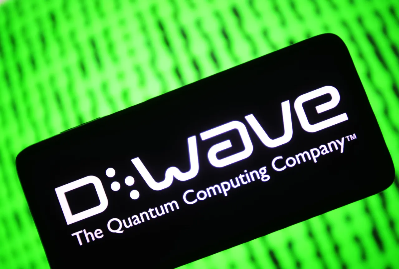 In this photo illustration, D-Wave Systems Inc. logo of a Canadian quantum computing company is seen on a smartphone screen. 