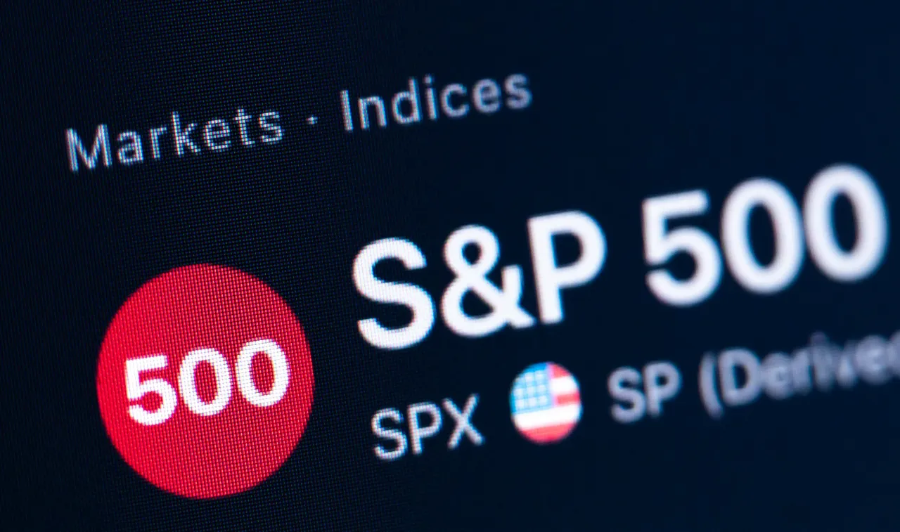 The logo of the American S&P 500 Index can be seen on the monitor of a computer in an office.