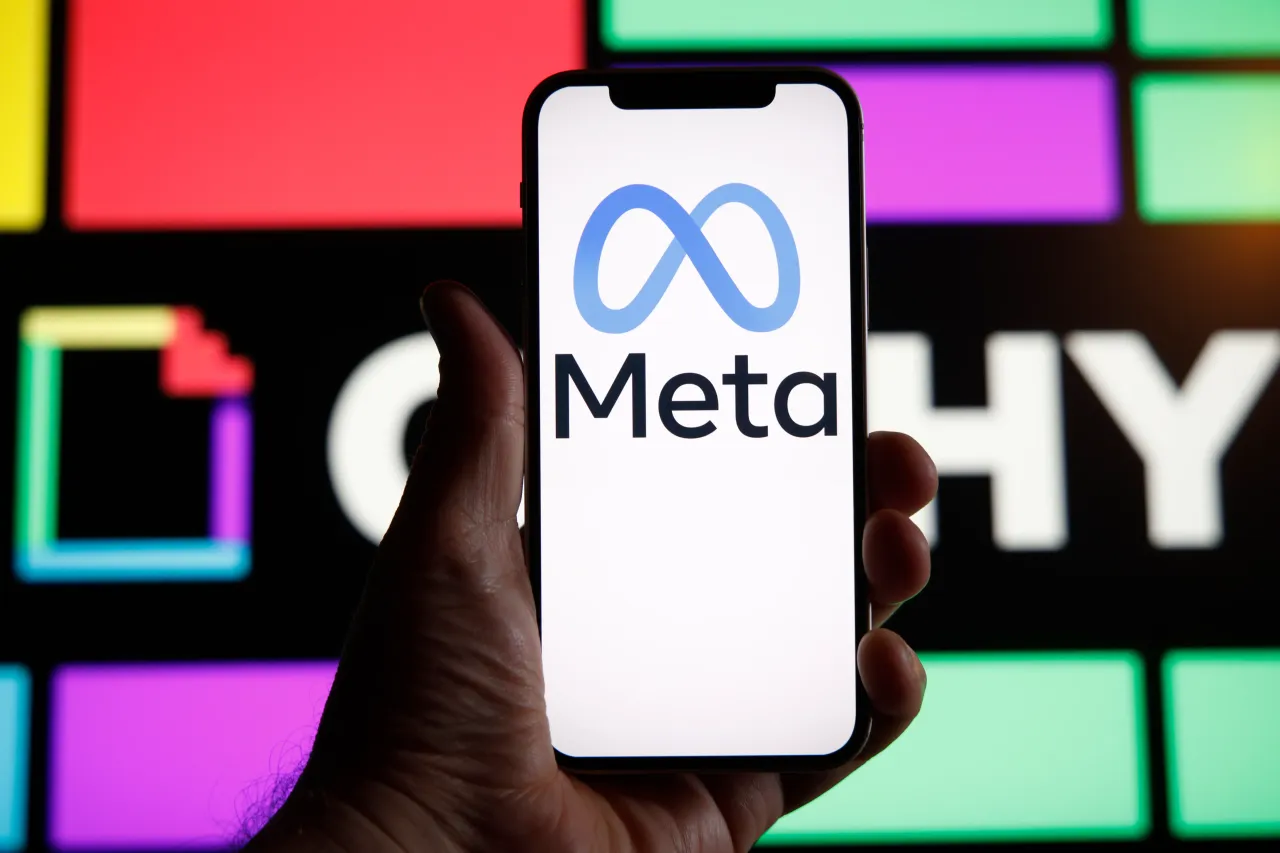 The Meta logo is seen with the Giphy logo in the background in this illustration photo. (Photo by STR/NurPhoto via Getty Images)