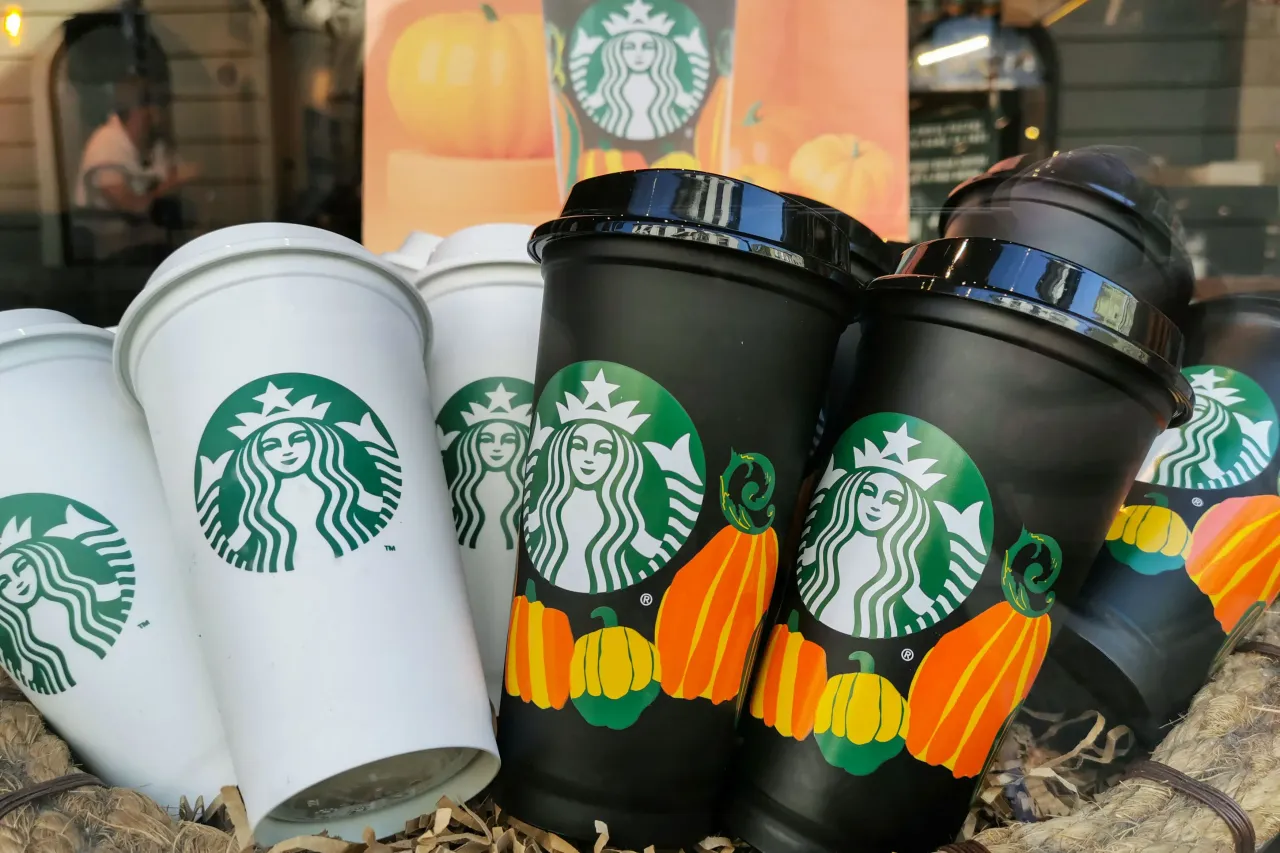 Starbucks pumpkin and regular reusable cups are seen on display in Starbucks in Krakow, Poland on October 28, 2022.