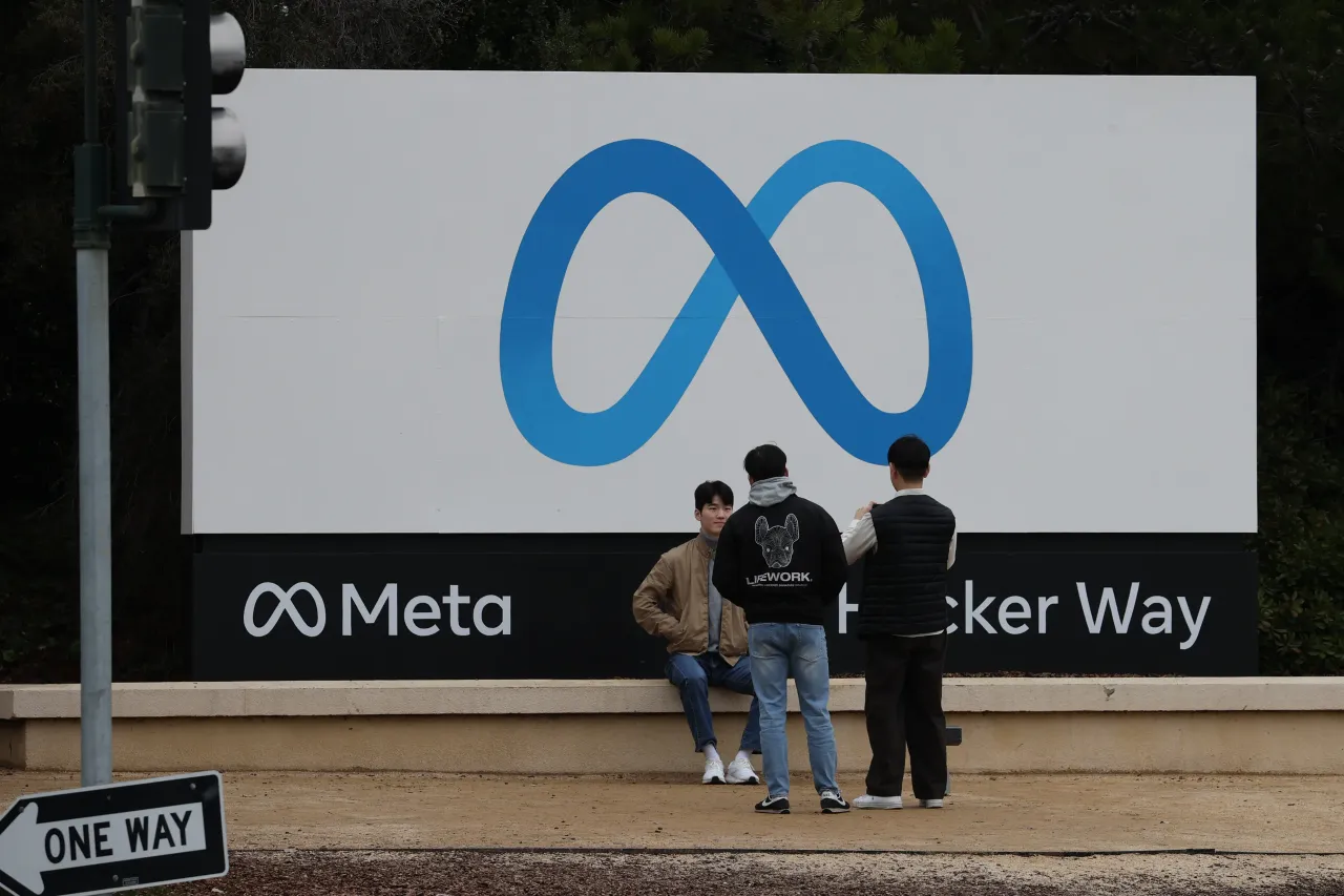 Visitors take photos in front of the Meta (Facebook) sign at its headquarters in Menlo Park, California. (Photo by Tayfun Coskun/Anadolu Agency via Getty Images)
