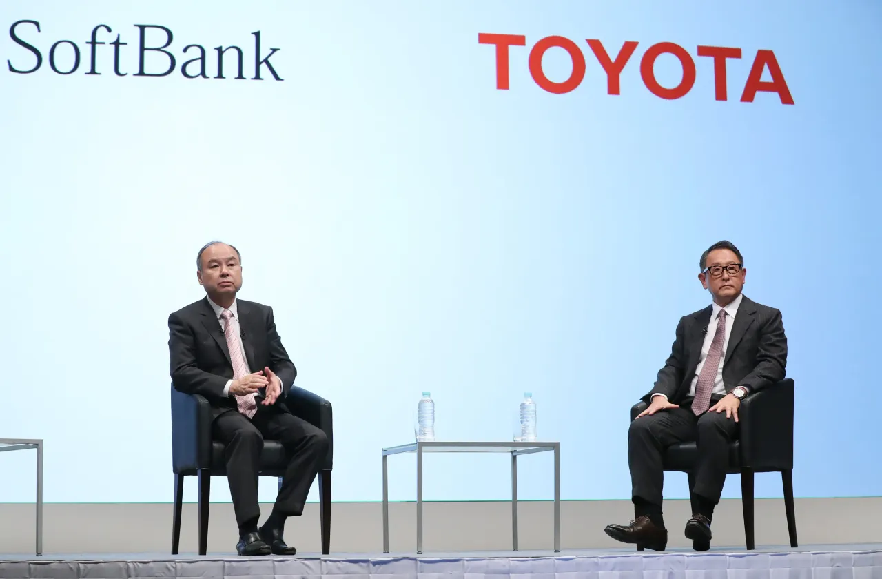 Toyota Motor president Akio Toyoda and Softbank president Masayoshi Son pictured at a press conference in Tokyo on October 4, 2018.