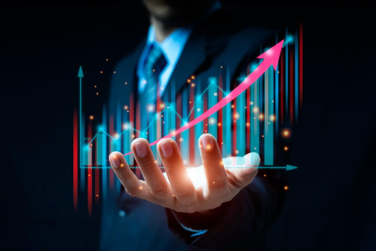 Businessman hand working with new modern computer and financial symbols coming. - stock photo