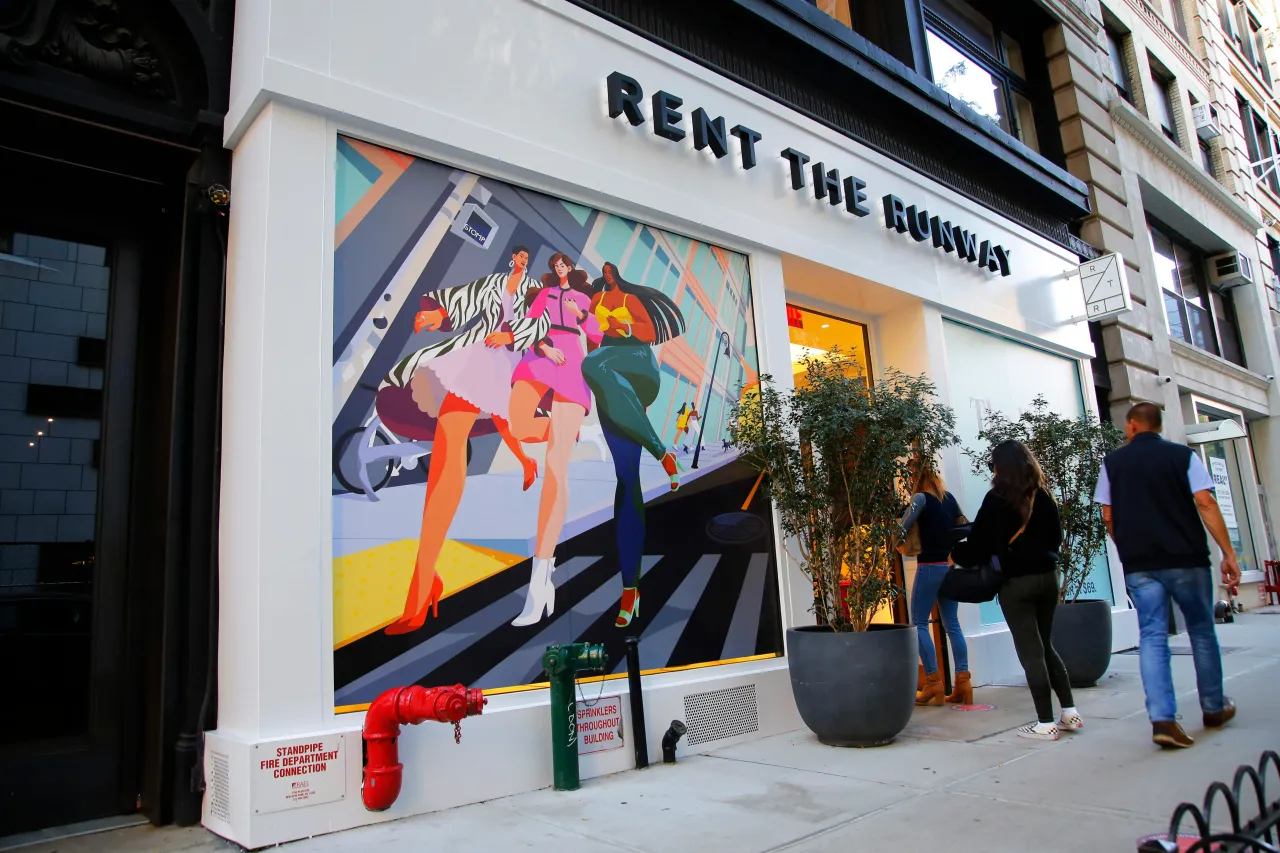 People walk past the Rent the Runway store on October 22, 2021 in New York City. (Photo by Michael M. Santiago/Getty Images)