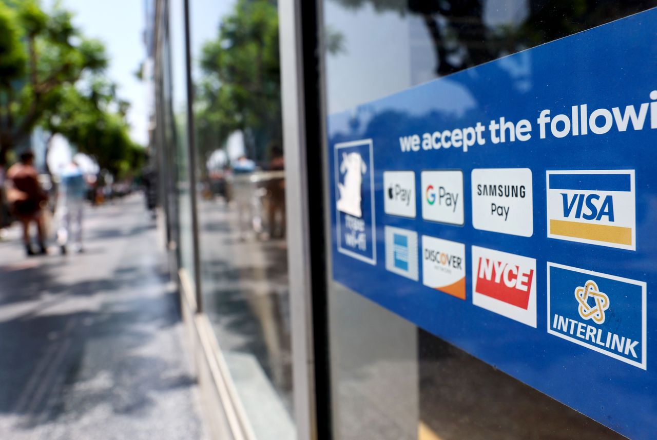 LOS ANGELES, CALIFORNIA - JULY 26: A window sticker advertising Visa and other payment methods is displayed in a store window on July 26, 2022 in Los Angeles, California. Visa is set to release its third quarter earnings after the stock market closes today. (Photo by Mario Tama/Getty Images)