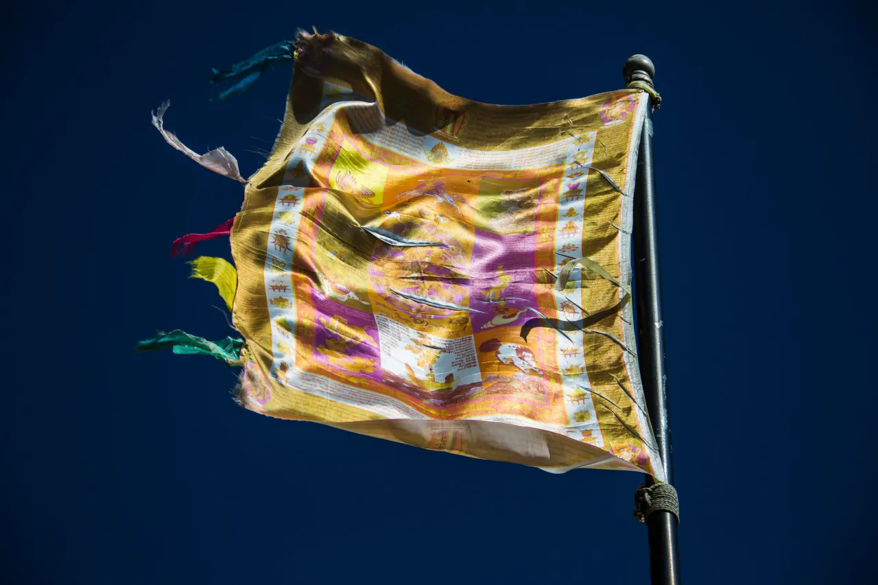 TRONGSA, BHUTAN - NOVEMBER 18: Traditional flag near the Trongsa Dzong with museum and watchtower on November 18, 2012 in Trongsa, Bhutan. (Photo by EyesWideOpen/Getty Images)