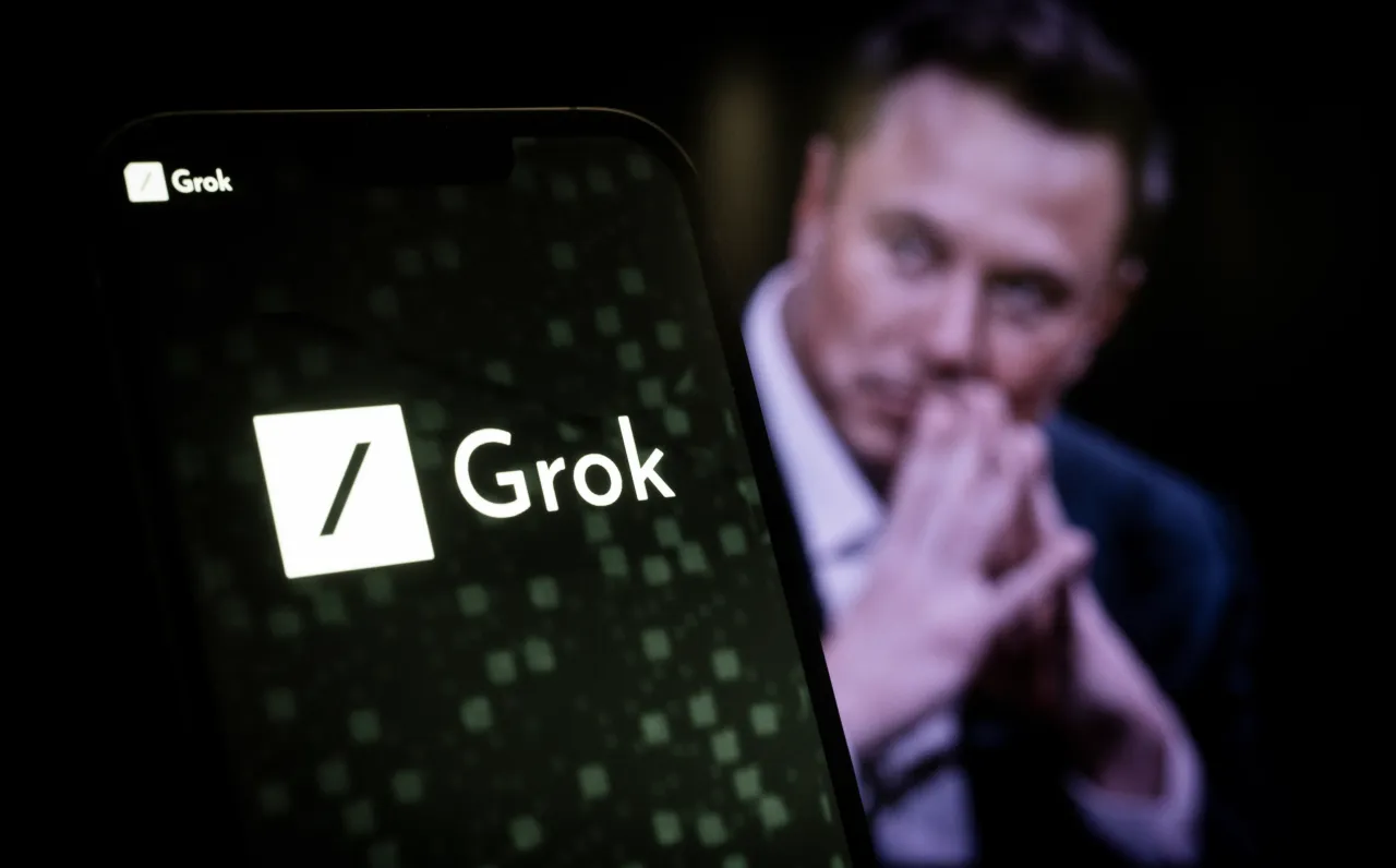 The xAI and Grok logos are seen in this illustration photo, with Elon Musk's picture in the background. (Photo by Jaap Arriens/NurPhoto via Getty Images)