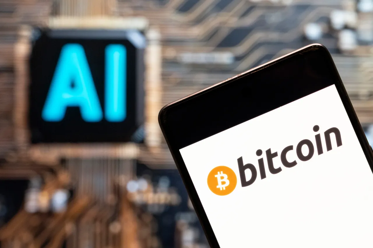 In this photo illustration, the cryptocurrency electronic cash Bitcoin (BTC, BCH) logo seen displayed on a smartphone with an Artificial intelligence (AI) chip (Photo Illustration by Budrul Chukrut/SOPA Images/LightRocket via Getty Images)