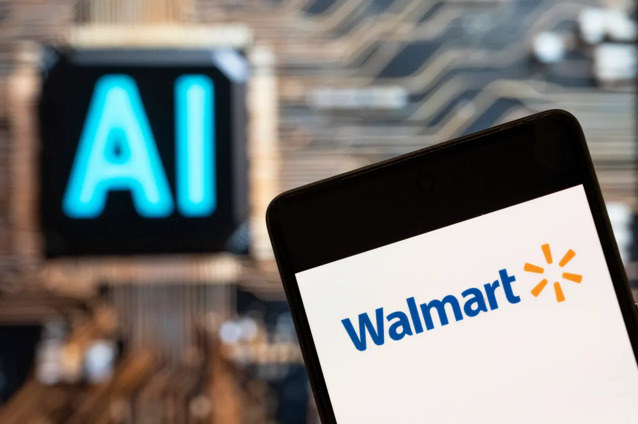 Walmart logo seen displayed on a smartphone with an AI chip and symbol in the background. (Photo Illustration by Budrul Chukrut/SOPA Images/LightRocket via Getty Images)