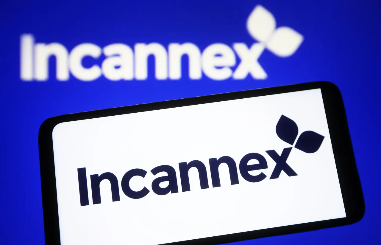In this photo illustration, Incannex Healthcare Inc. logo is seen on a smartphone and in the background.