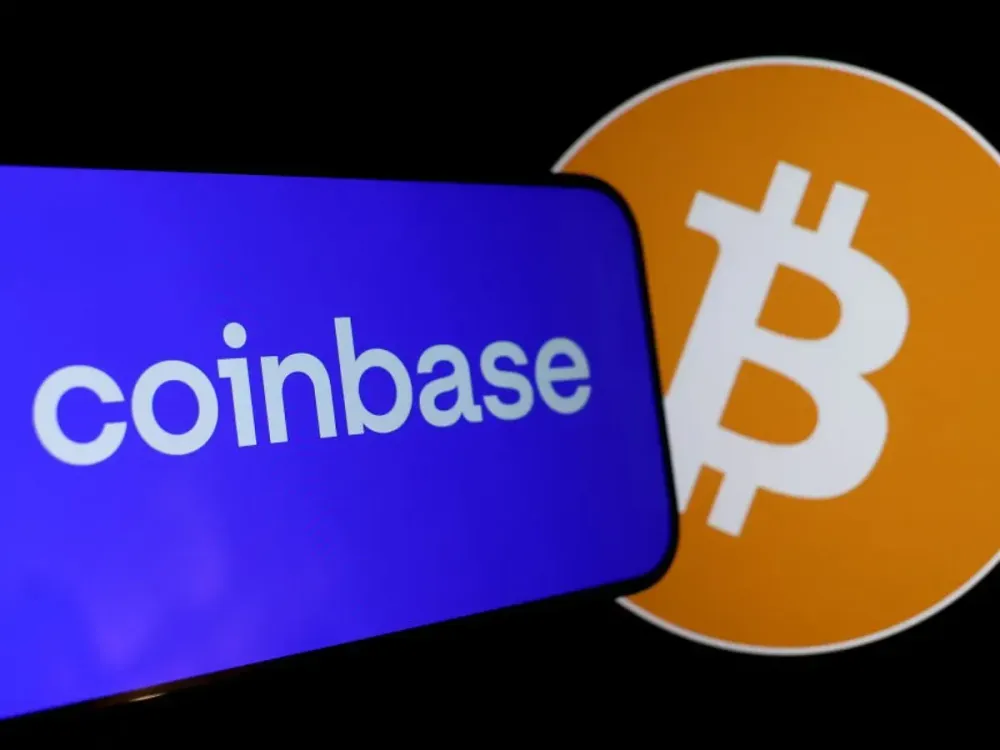  In this photo illustration, the Coinbase and Bitcoin logos are displayed on a phone screen on February 15, 2024 in San Anselmo, California. 