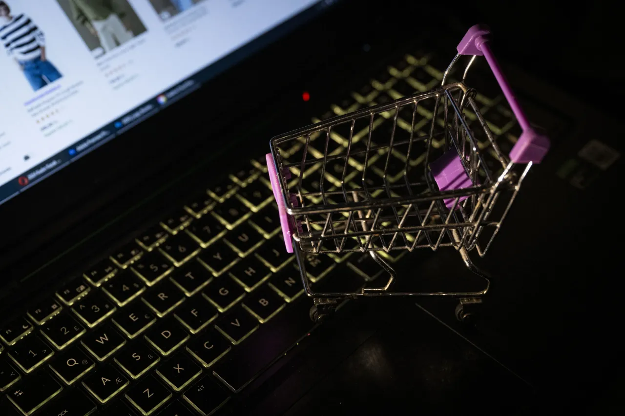 A miniature shopping cart is seen on a laptop with its screen displaying an online shopping website in Ankara, Turkiye on March 06, 2024. (Photo by Betul Abali/Anadolu via Getty Images)