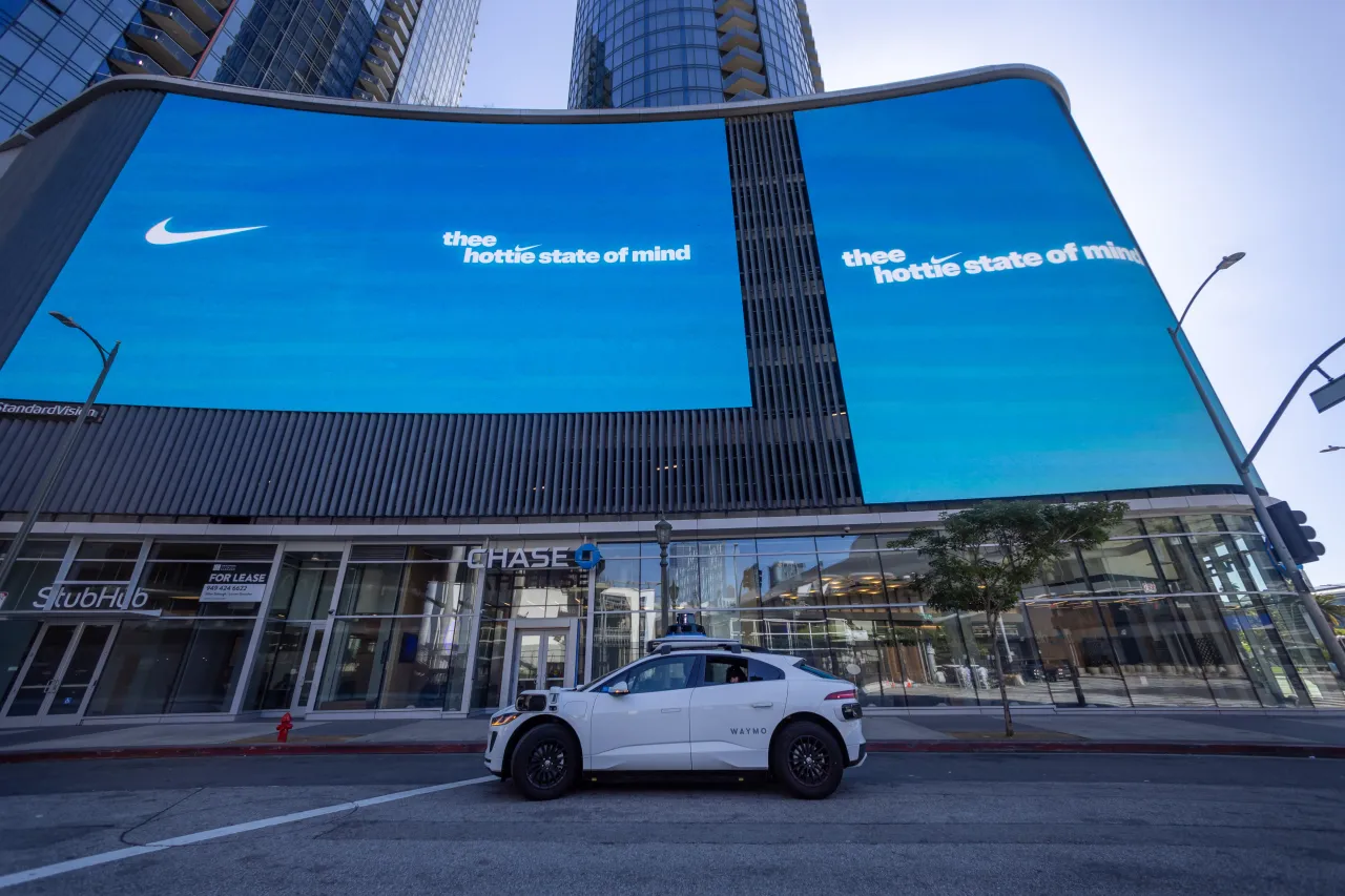 A Waymo robotaxi Jaguar I-PACEs driverless car makes a stop in downtown Los Angeles Monday, March 11, 2024. (Allen J. Schaben / Los Angeles Times via Getty Images)