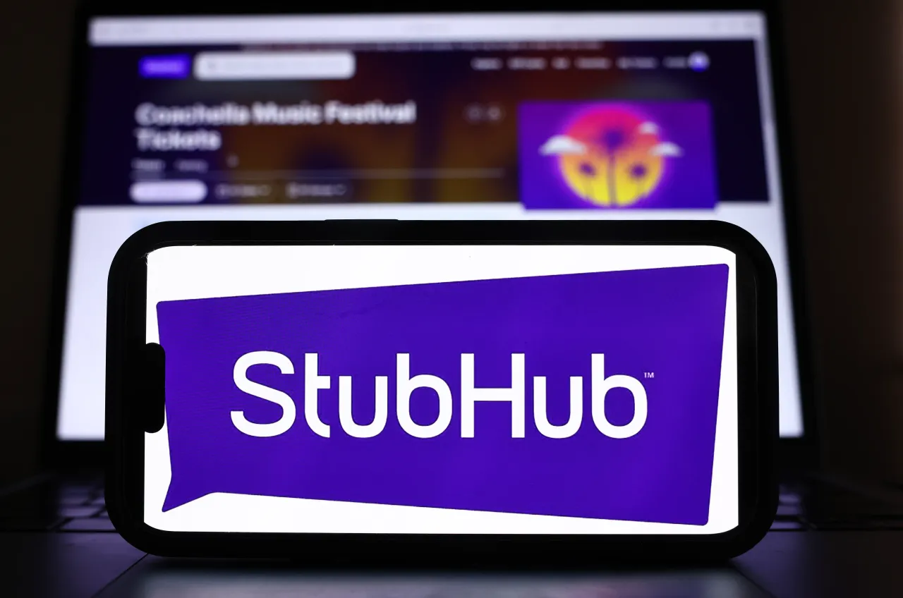 The StubHub logo and webpage are displayed on a cell phone and computer monitor. (Photo Illustration by Mario Tama/Getty Images)