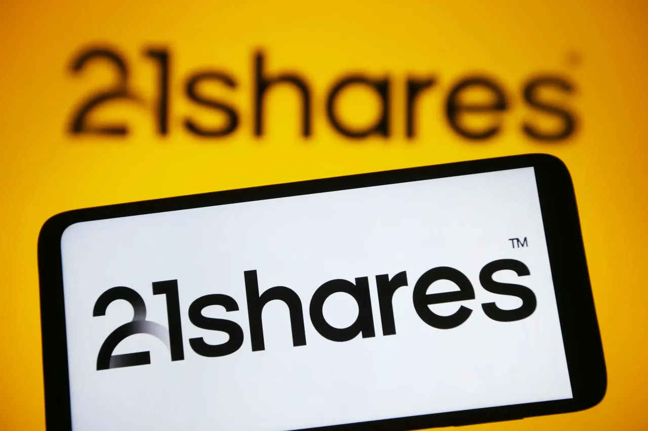 In this photo illustration, a 21Shares logo is seen on a smartphone and on a pc screen. (Photo Illustration by Pavlo Gonchar/SOPA Images/LightRocket via Getty Images)