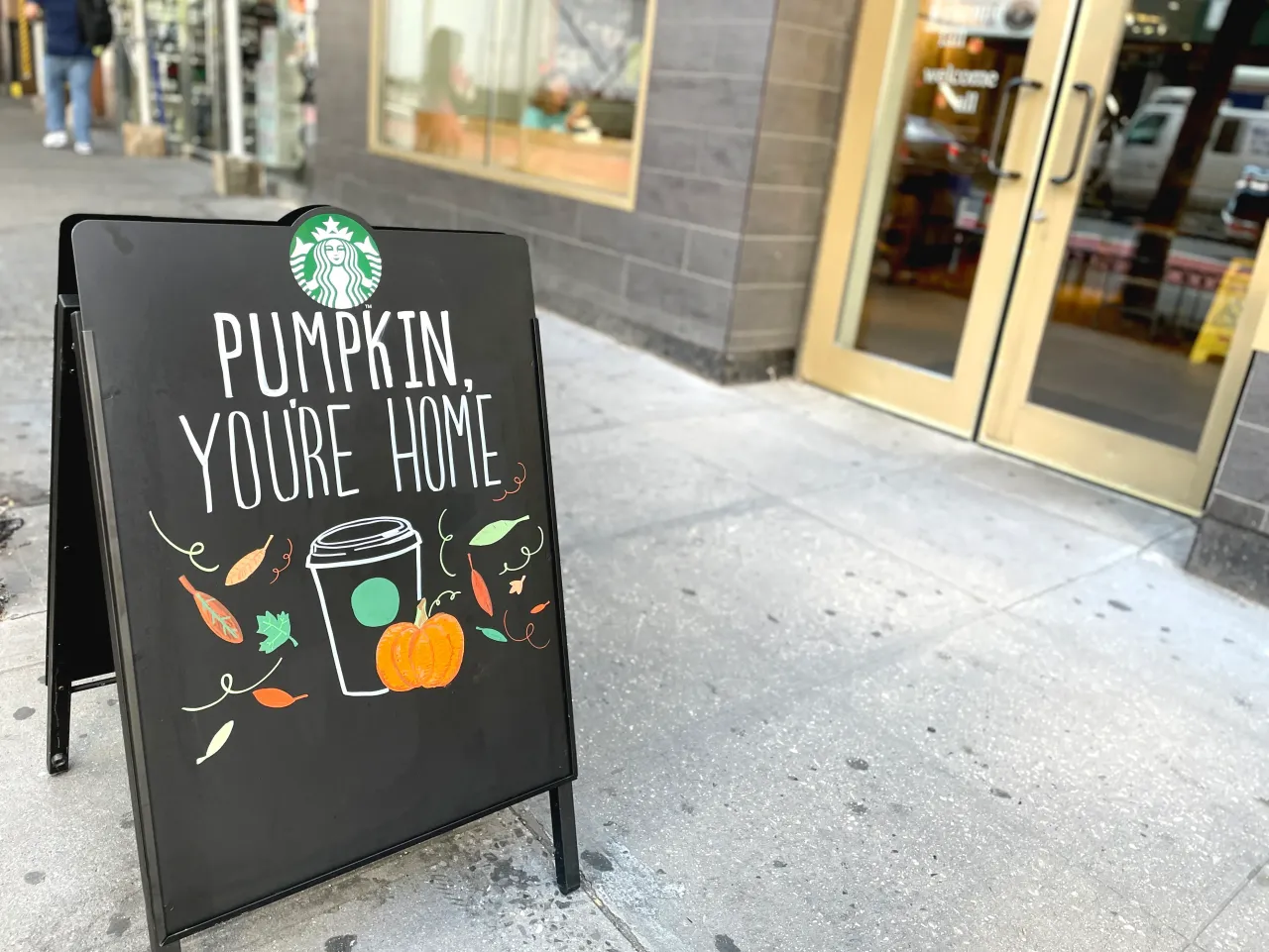 A sign board outside a Starbucks cafe in New York, announcing that pumpkin spice coffee is available. (Photo by: Deb Cohn-Orbach/UCG/Universal Images Group via Getty Images)