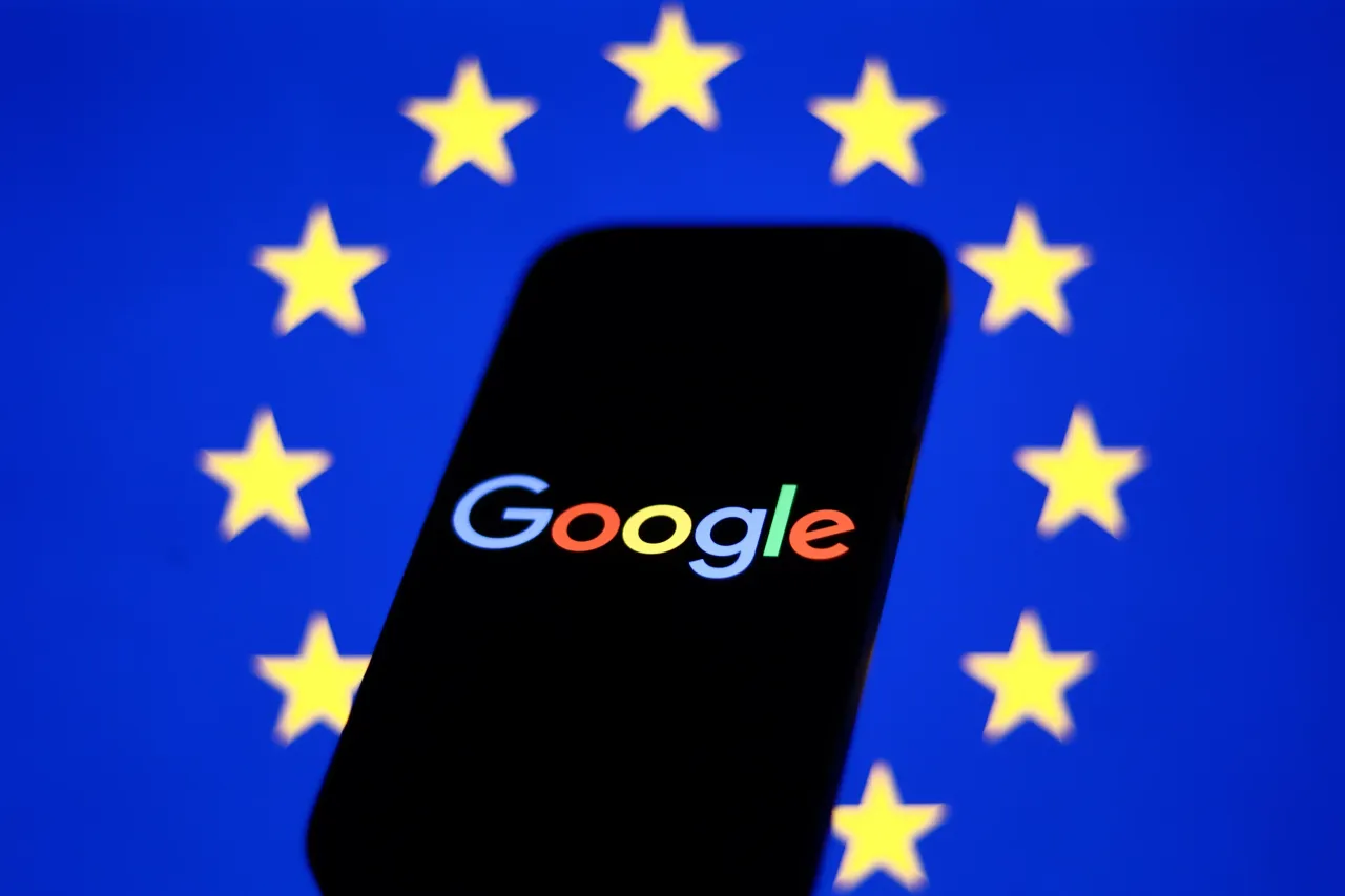 European Union flag displayed on a laptop screen and Google logo displayed on a phone screen are seen in this illustration photo taken in Krakow, Poland.