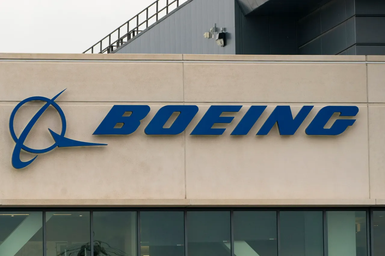 A Boeing sign is seen on the exterior of a building.