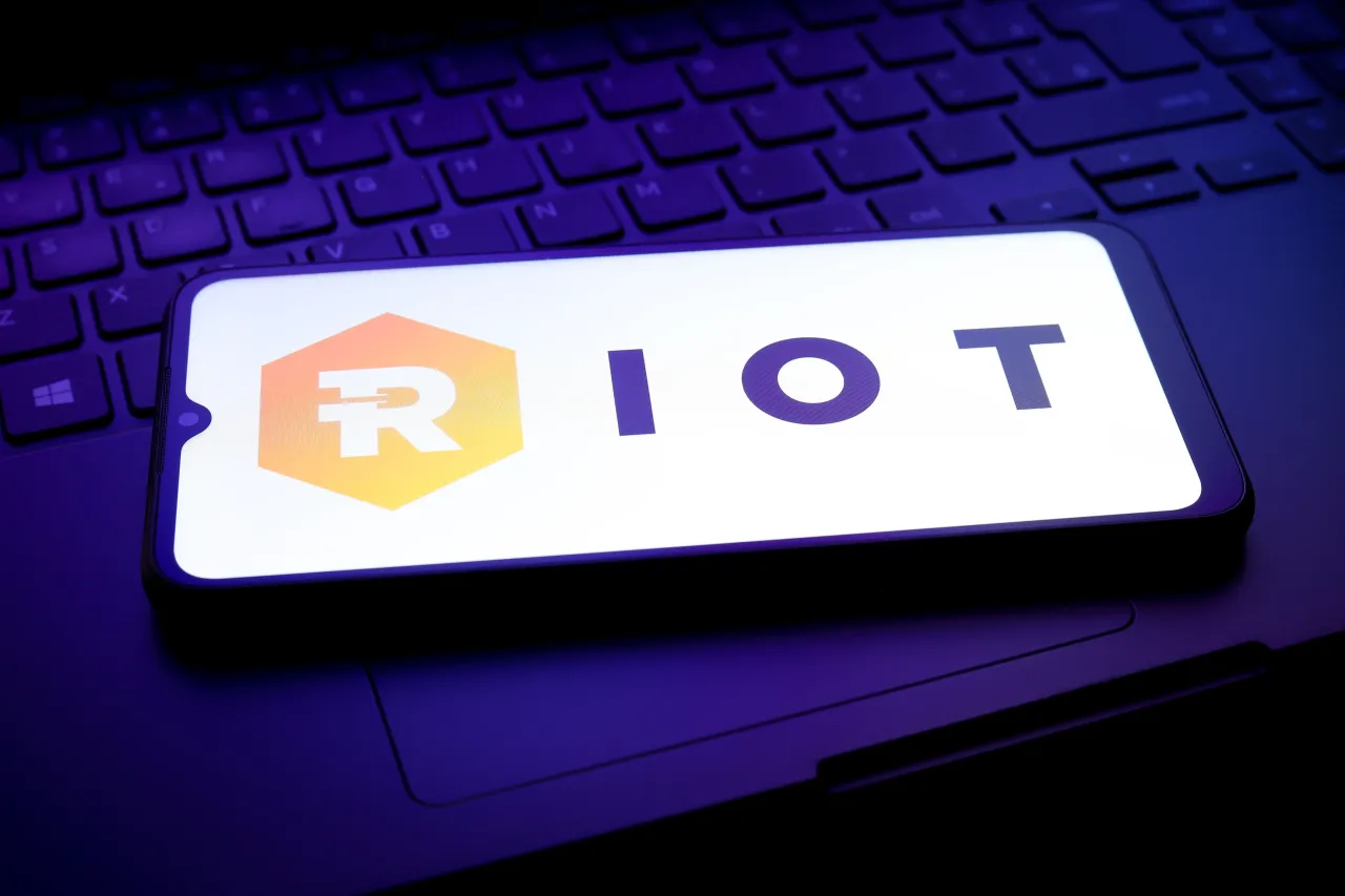 The Riot Platforms logo appears on a smartphone screen in this illustration photo in Reno, United States, on December 25, 2024.