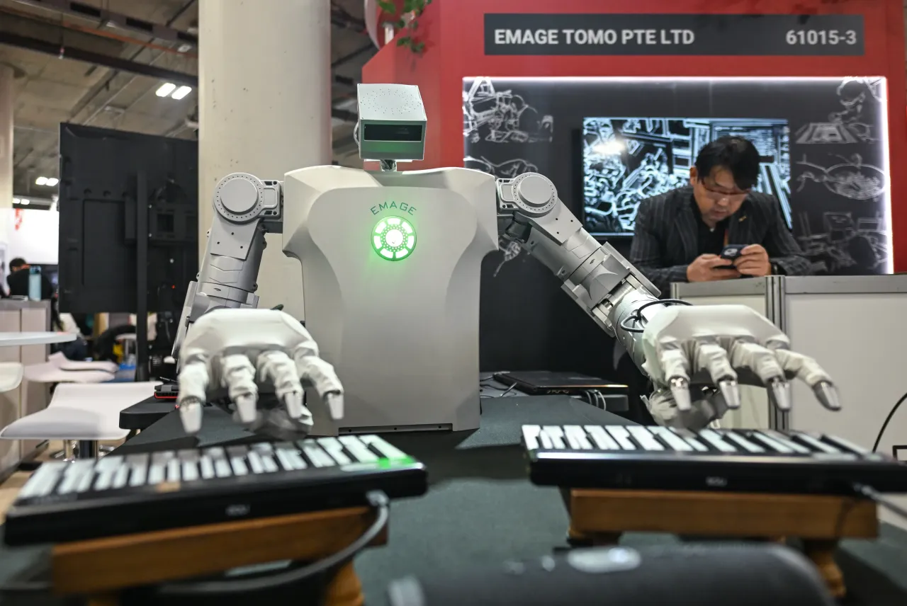 A robot from Emage Vision plays the piano at the Consumer Electronics Show (CES) on January 8, 2025. (Photo by Artur Widak/Anadolu via Getty Images)