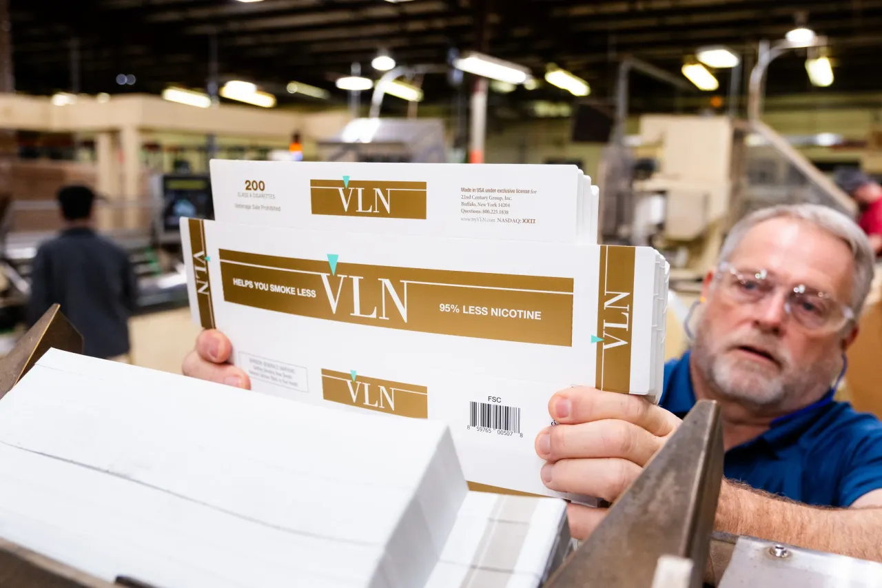 An employee loads VLN Cigarette packaging at a 22nd Century Group manufacturing facility in Mocksville. (Cornell Watson for The Washington Post via Getty Images)