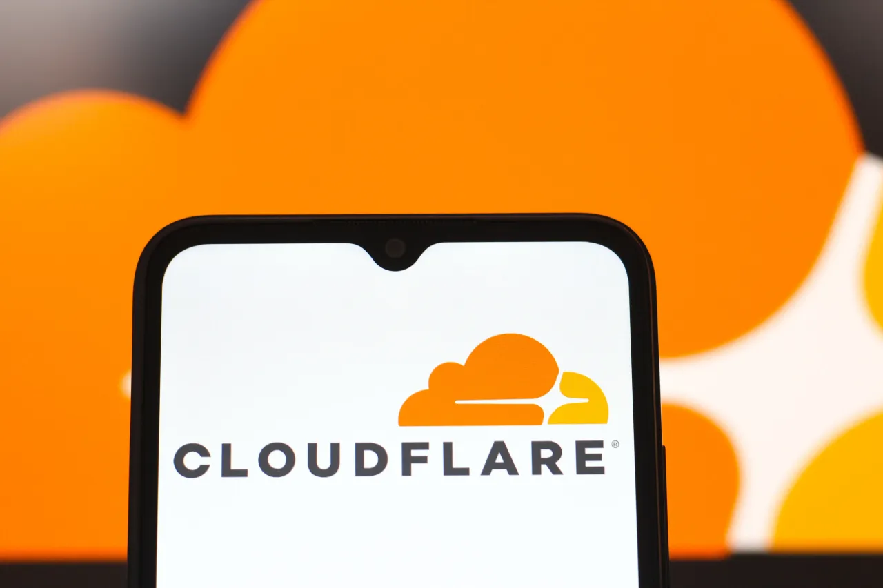 In this photo illustration, the Cloudflare logo is seen displayed on a smartphone screen. 